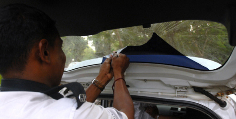 Goa Police removing tinted window film